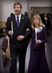 The wedding begins. Bride's parents walk up to light the candle representing Kristina.
